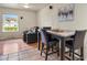 Dining area with tile flooring, a table with seating for four and modern decor at 10645 Moore Ct, Broomfield, CO 80020