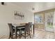 Cozy dining area featuring a table with seating for four and bright natural light at 10645 Moore Ct, Broomfield, CO 80020