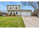 This charming home features a well-manicured lawn, an attached two-car garage and classic curb appeal at 10645 Moore Ct, Broomfield, CO 80020