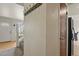 Hallway featuring carpeted floors, coat rack, and white walls at 10645 Moore Ct, Broomfield, CO 80020