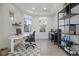 Light-filled office space featuring light walls, tray ceiling, luxury vinyl floors, and modern shelving at 10538 Ashfield St, Highlands Ranch, CO 80126