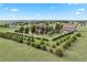 Aerial view showing expansive property, large house, detached garage, and manicured trees at 3519 Zane Gray Loop, Parker, CO 80138