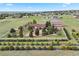 Aerial view showcasing the house with white fence, mature trees, landscaping, and acreage at 3519 Zane Gray Loop, Parker, CO 80138