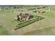 Scenic aerial shot of the property featuring a house with a white fence, and manicured trees at 3519 Zane Gray Loop, Parker, CO 80138