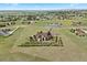 Aerial view of estate featuring a sprawling lawn, mature trees, circular driveway, and surrounding acreage at 3519 Zane Gray Loop, Parker, CO 80138