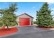 Large barn with a red door and ample parking space in a serene, rural setting at 3519 Zane Gray Loop, Parker, CO 80138