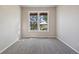 Empty bedroom with neutral carpet and paint and a window overlooking the landscape at 3519 Zane Gray Loop, Parker, CO 80138