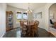 Bright dining area featuring hardwood floors, a charming chandelier, and lots of natural light at 3519 Zane Gray Loop, Parker, CO 80138