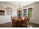 Spacious dining room featuring hardwood floors and a charming chandelier with lots of natural light at 3519 Zane Gray Loop, Parker, CO 80138