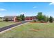 Exterior view featuring a house, large garage, circular driveway, and green landscaping at 3519 Zane Gray Loop, Parker, CO 80138