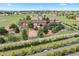 Stunning exterior view of home, mature trees, white picket fence, and beautifully landscaped property at 3519 Zane Gray Loop, Parker, CO 80138