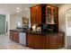 Well-appointed kitchen with granite counters, a stainless steel dishwasher and a view into the living room at 3519 Zane Gray Loop, Parker, CO 80138