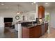 Open kitchen design with granite countertops, stainless steel appliances, and seamless transition to living room at 3519 Zane Gray Loop, Parker, CO 80138
