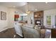 Comfortable living room with a stone fireplace and an open view into the kitchen area at 3519 Zane Gray Loop, Parker, CO 80138