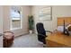 Bright office space featuring a large window with views, carpet flooring, and comfortable office furniture at 3519 Zane Gray Loop, Parker, CO 80138