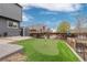 The backyard features a charming putting green for recreational enjoyment with an adjacent garden area at 6307 Monterey Pl, Highlands Ranch, CO 80130
