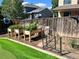Well-maintained backyard featuring raised garden beds and artificial turf for easy upkeep at 6307 Monterey Pl, Highlands Ranch, CO 80130
