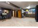 Finished basement featuring carpet, a television and neutral color paint at 6307 Monterey Pl, Highlands Ranch, CO 80130