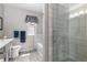 Bright bathroom showing a glass shower enclosure and a window with valance above the tub at 6307 Monterey Pl, Highlands Ranch, CO 80130