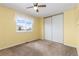 Bright bedroom with a large window and spacious closet at 6307 Monterey Pl, Highlands Ranch, CO 80130