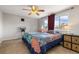 Comfortable bedroom with large windows offering plenty of natural light at 6307 Monterey Pl, Highlands Ranch, CO 80130