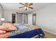 Spacious bedroom with a walk-in closet and a barn door, blending style and functionality at 6307 Monterey Pl, Highlands Ranch, CO 80130