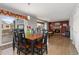 Cozy dining room featuring a fireplace and hardwood floors, perfect for gatherings and entertaining at 6307 Monterey Pl, Highlands Ranch, CO 80130