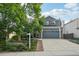 Charming two-story home with a well-manicured lawn and a spacious two-car garage at 6307 Monterey Pl, Highlands Ranch, CO 80130