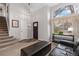Bright foyer with large window and dark entry door leading into the living space at 6307 Monterey Pl, Highlands Ranch, CO 80130