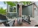 Charming front porch with comfortable chairs, providing a welcoming outdoor space at 6307 Monterey Pl, Highlands Ranch, CO 80130