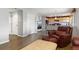 Cozy living room with an opening looking into the spacious kitchen area at 6307 Monterey Pl, Highlands Ranch, CO 80130