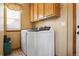 Laundry room with washer, dryer, and upper cabinets at 13262 Pennsylvania St, Thornton, CO 80241