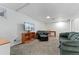 Cozy finished basement featuring plush carpet, sofa, and entertainment center, perfect for relaxation at 3100 W 94Th Ave, Westminster, CO 80031
