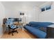 Basement office space with a desk, monitors, and a futon, ideal for work and relaxation at 3100 W 94Th Ave, Westminster, CO 80031