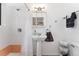 A bright bathroom with a tile shower and a pedestal sink at 3100 W 94Th Ave, Westminster, CO 80031