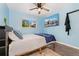 Cozy bedroom with a ceiling fan, mounted TV, and a window with natural light at 3100 W 94Th Ave, Westminster, CO 80031