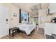 A modern bedroom with white walls, light brown floors, and a simple kitchenette at 3100 W 94Th Ave, Westminster, CO 80031