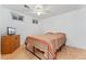 Bedroom features a double bed frame, ceiling fan, and natural light from two windows at 3100 W 94Th Ave, Westminster, CO 80031