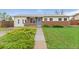 Charming single-story home with a brick facade and well-maintained lawn, with a walkway leading to the front door at 3100 W 94Th Ave, Westminster, CO 80031