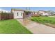 Attractive single-story home with a well-manicured lawn, featuring a front porch and a driveway leading to the property at 3100 W 94Th Ave, Westminster, CO 80031