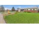 Quaint single-story home with brick and siding, featuring a lush green lawn and tidy landscaping in a residential neighborhood at 3100 W 94Th Ave, Westminster, CO 80031
