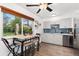 Charming kitchen featuring a breakfast nook, blue backsplash, and stainless steel appliances at 3100 W 94Th Ave, Westminster, CO 80031