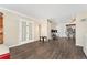 A living room with a view to the dining area and equipped with double doors at 3100 W 94Th Ave, Westminster, CO 80031