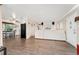 Spacious open-concept living area with wood floors, a large sofa, and views into the dining space at 3100 W 94Th Ave, Westminster, CO 80031