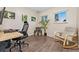 Functional office with a desk, chair, rocking chair, and natural light from two windows at 3100 W 94Th Ave, Westminster, CO 80031