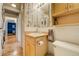 The bathroom has a vanity with wood cabinet and a toilet at 200 N Pearl St # 404, Denver, CO 80203