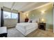 Cozy bedroom with large window and neutral color palette featuring standard closet for organized storage at 200 N Pearl St # 404, Denver, CO 80203