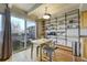 Bright dining area with sliding glass doors leading to balcony and custom storage shelves at 200 N Pearl St # 404, Denver, CO 80203