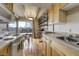 Kitchen with modern appliances, wood cabinets, and bright windows, offering a modern cooking experience at 200 N Pearl St # 404, Denver, CO 80203