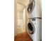 A stacked washer and dryer are located in an alcove near the bathroom at 200 N Pearl St # 404, Denver, CO 80203